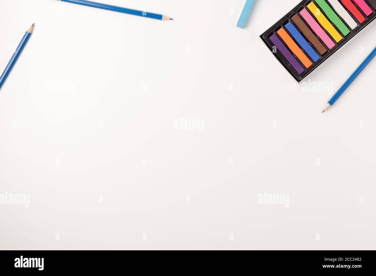 Colored wax crayons and pencils isolated on white background. Colorful ...