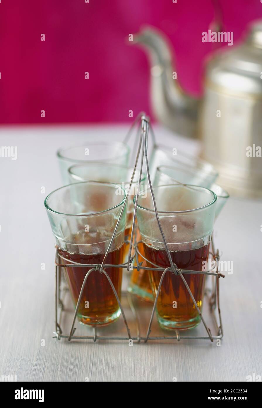 Wire rack with tea glasses, close up Stock Photo - Alamy