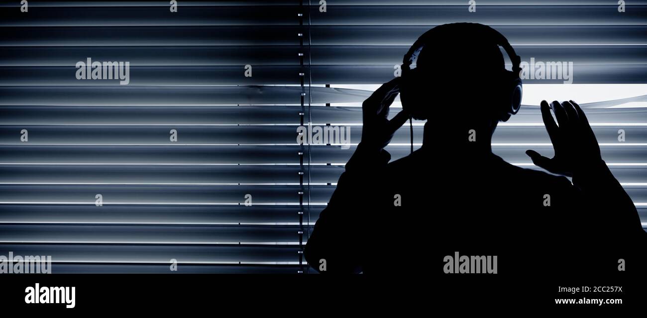 Germany, Bavaria, Man with head phone in recording studio Stock Photo