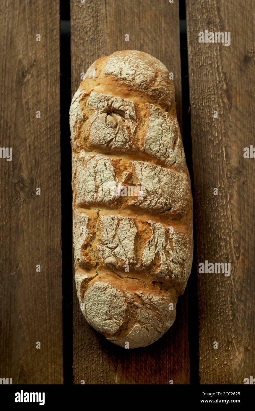 Rye bread on wooden table, close up Stock Photo