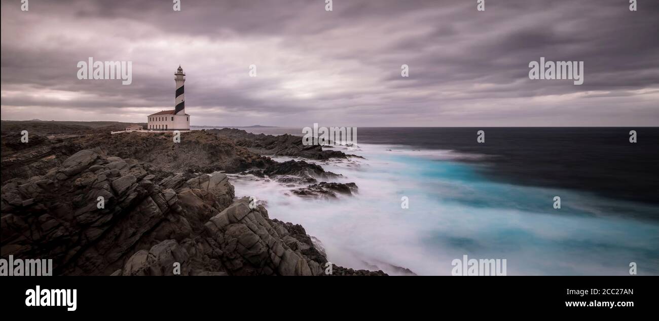 Spain, Menorca, Favaritx, View of lighthouse at sunset Stock Photo