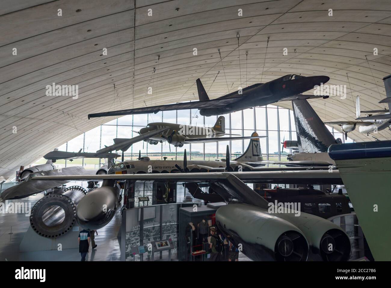 Inside the American Air Museum, Imperial War Museum, Duxford, Cambridgeshire, UK. Lockheed U2, over C-47, over B-29 Stock Photo