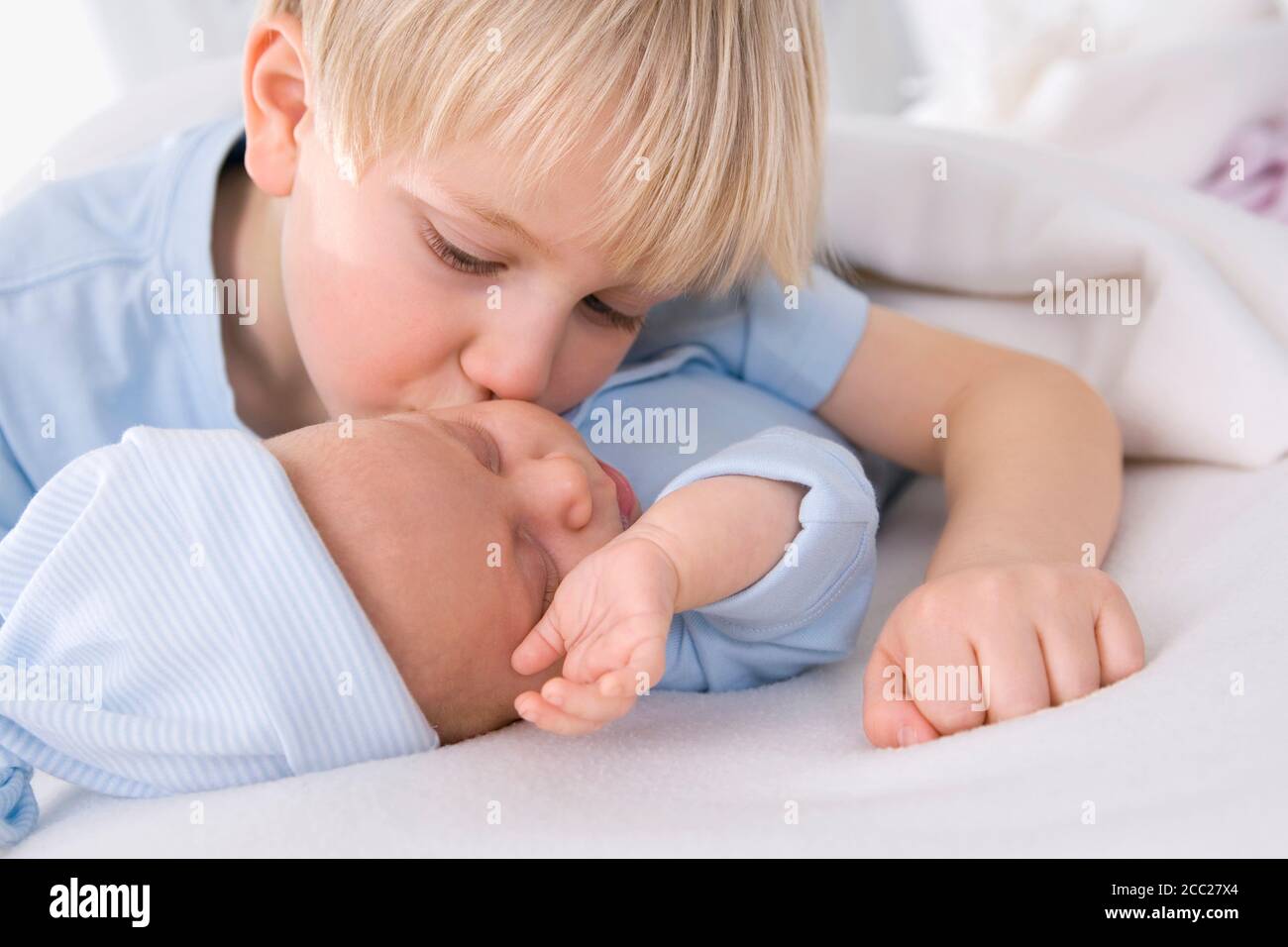 Baby girl (2 months) with boy (4-5 years), portrait Stock Photo