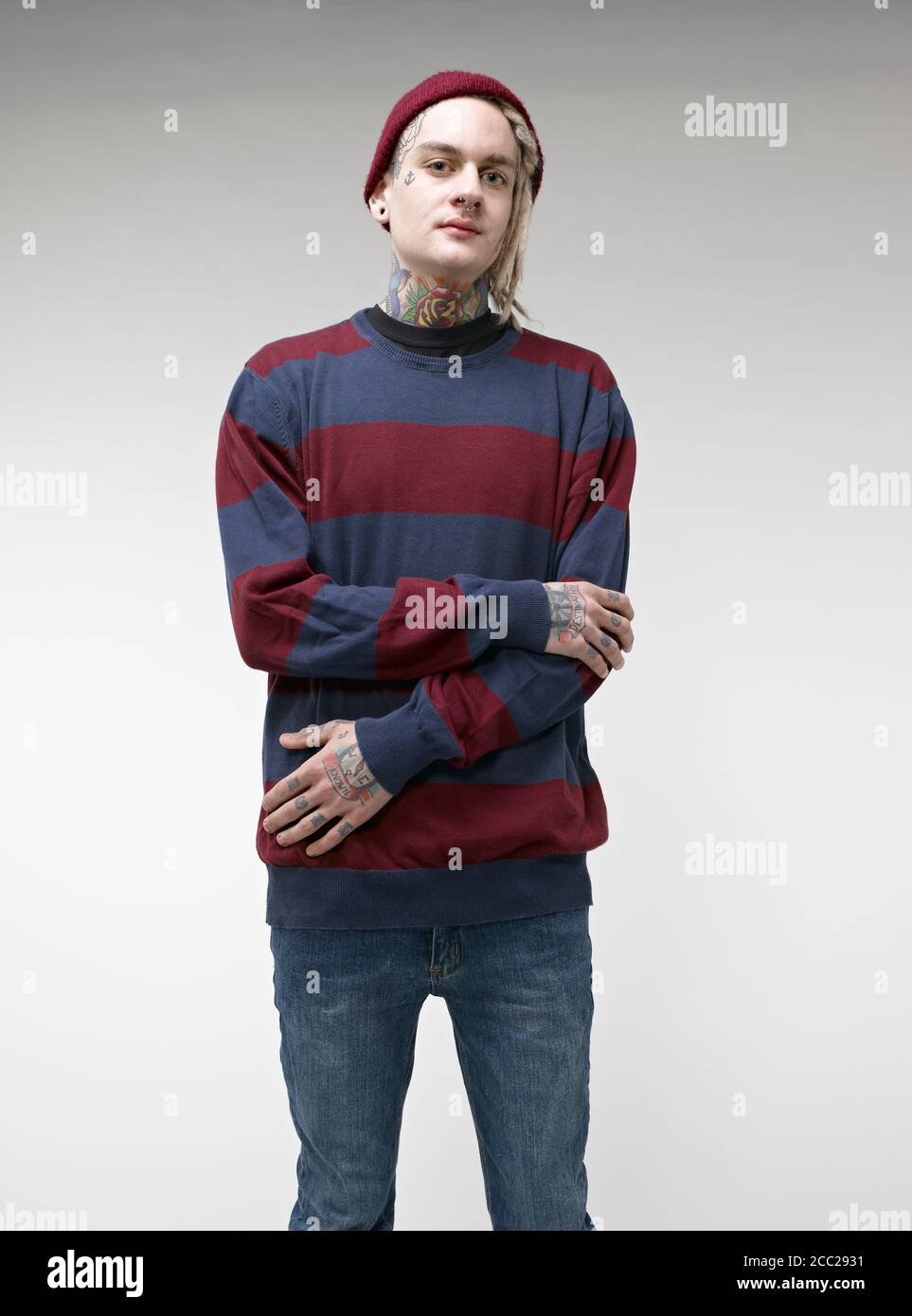 Portrait of young man with tattoos Stock Photo - Alamy