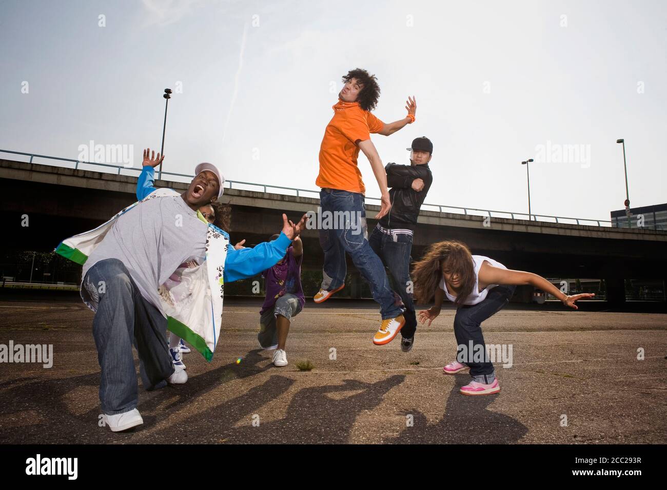 Germany, Cologne, Group of people breakdancing on street Stock Photo