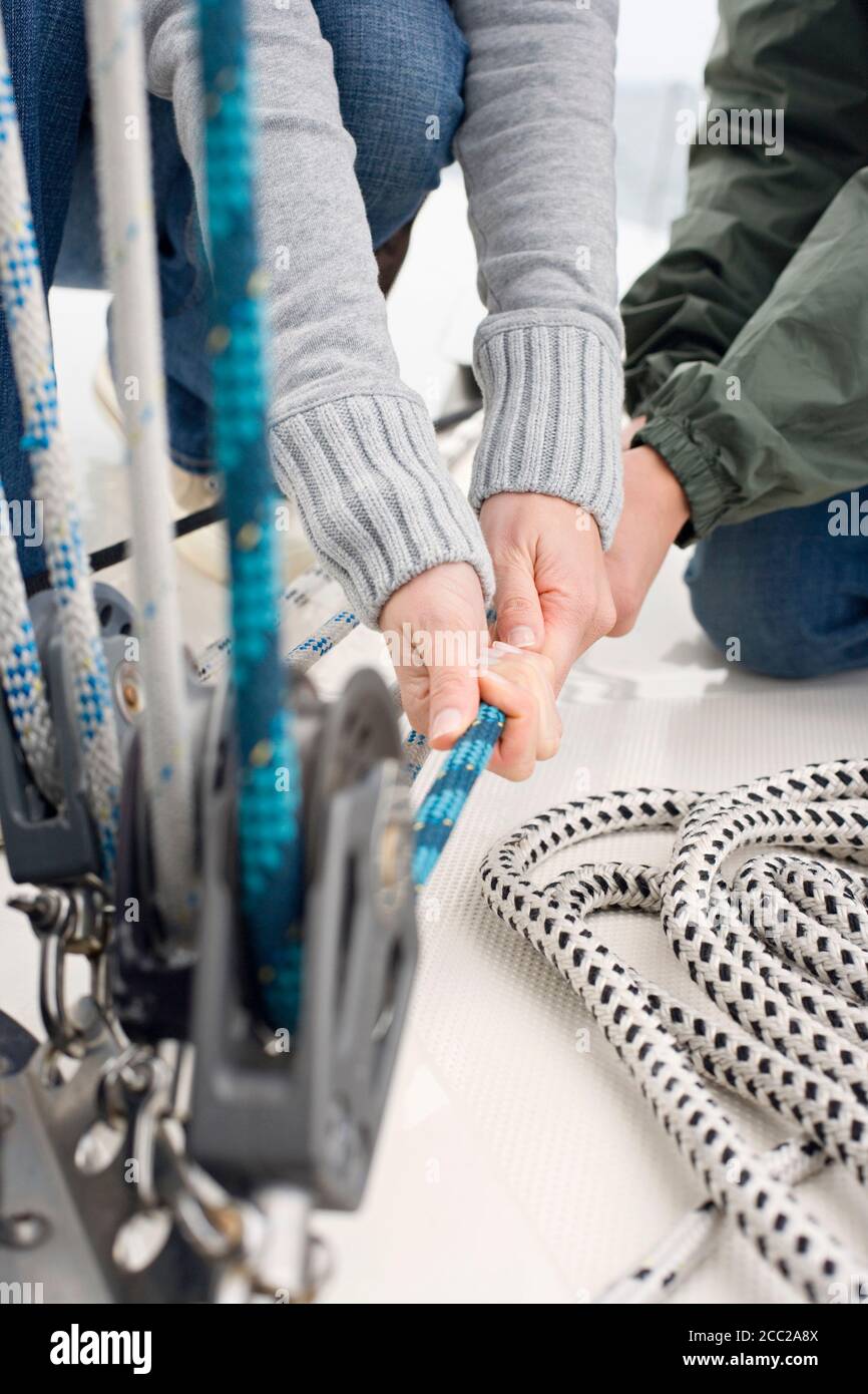 Two hands pulling rope hi-res stock photography and images - Alamy