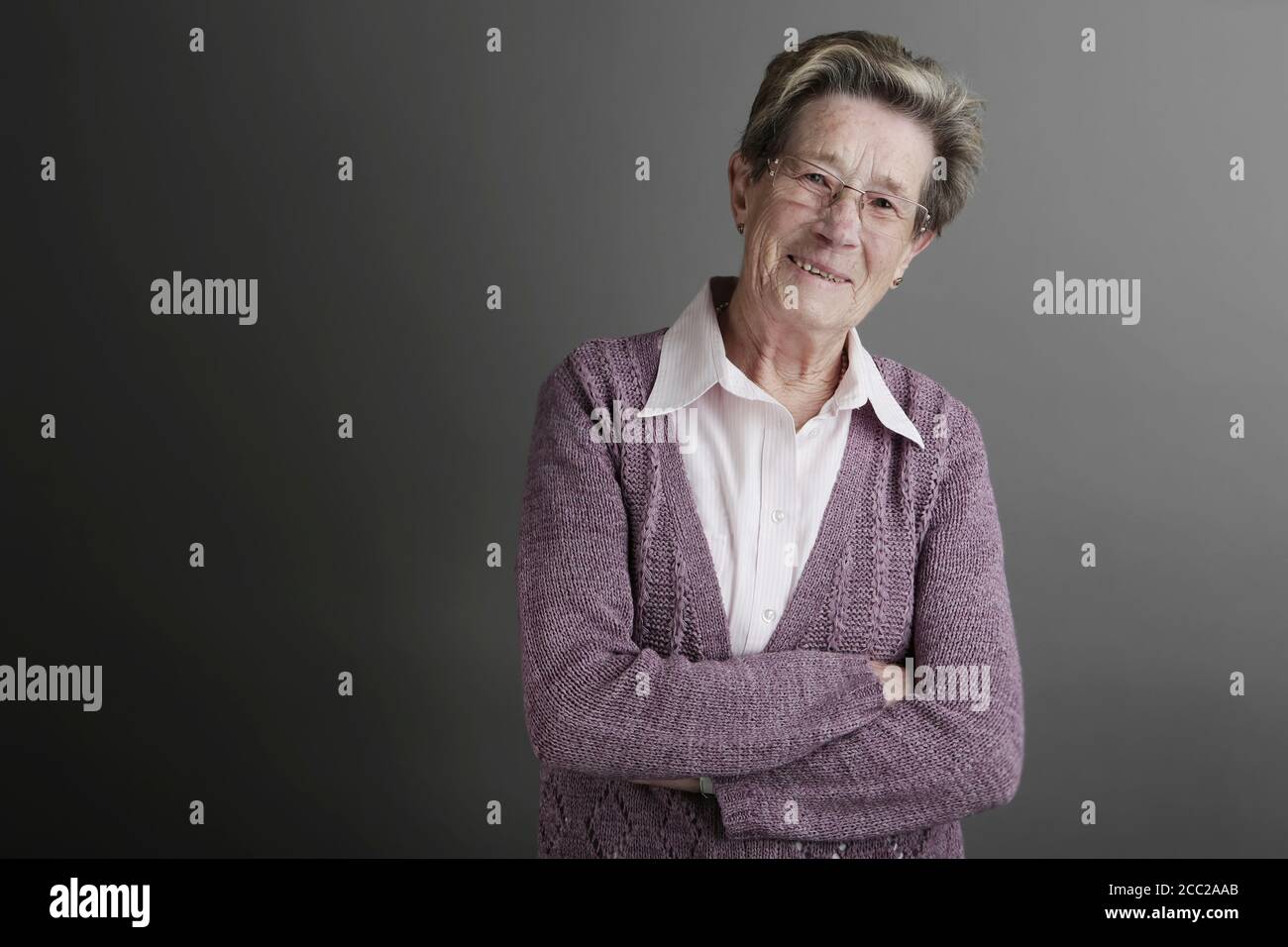 Old woman standing studio hi-res stock photography and images - Alamy