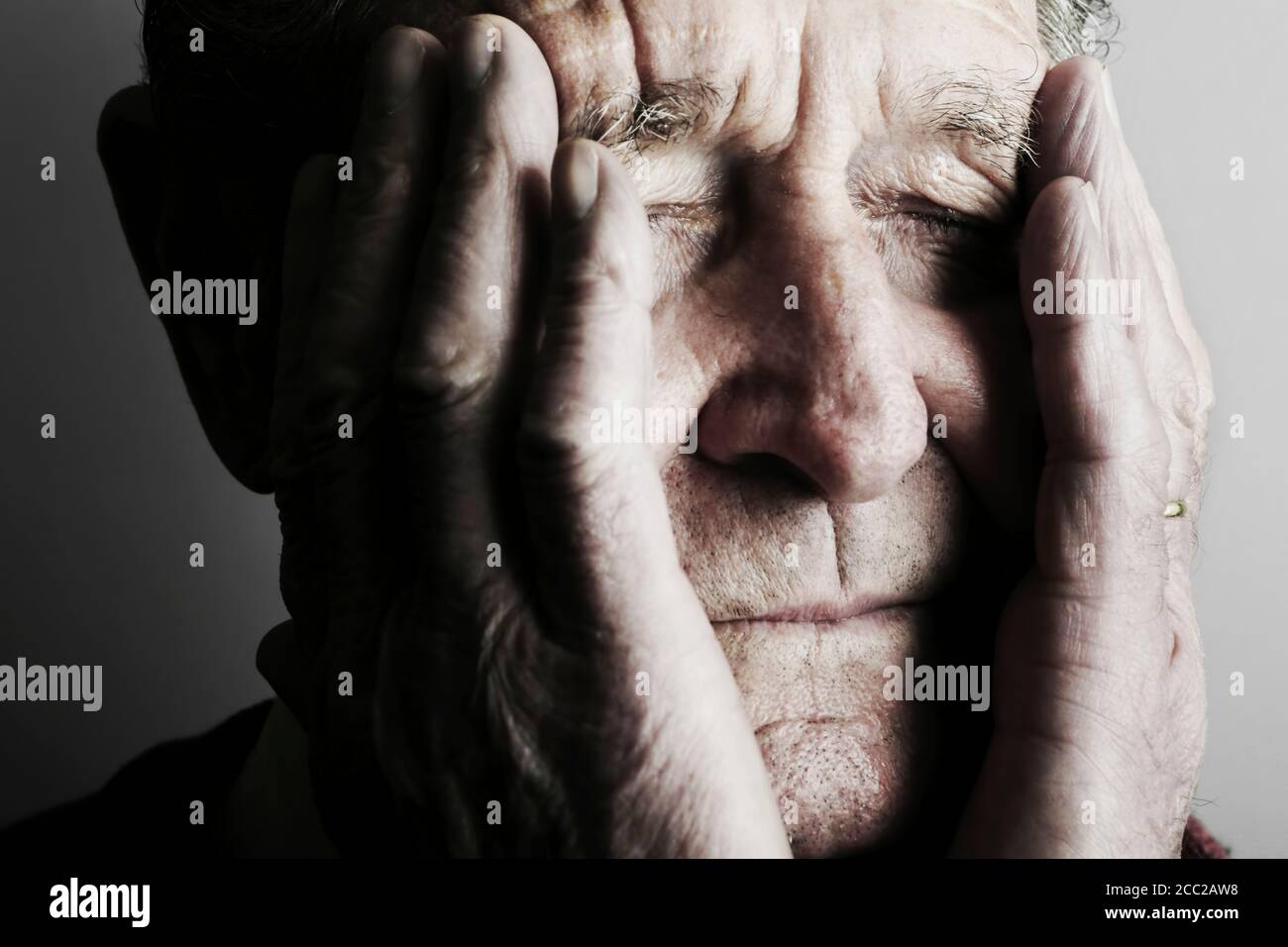 Senior mans eyes closed, close up Stock Photo