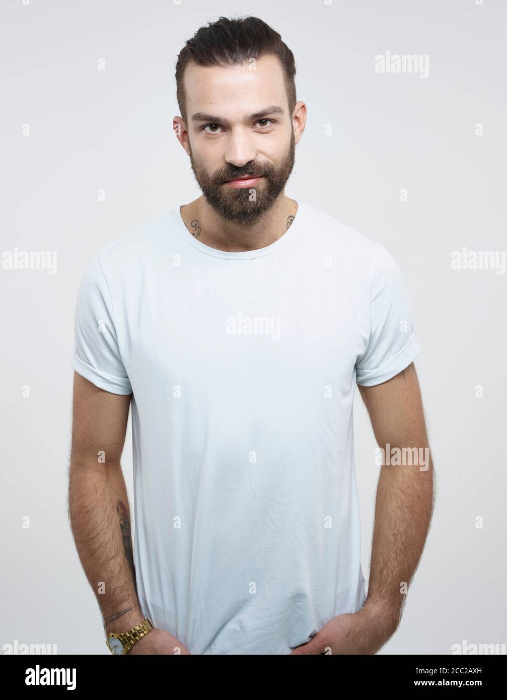 Portrait of young man against white background, smiling Stock Photo - Alamy