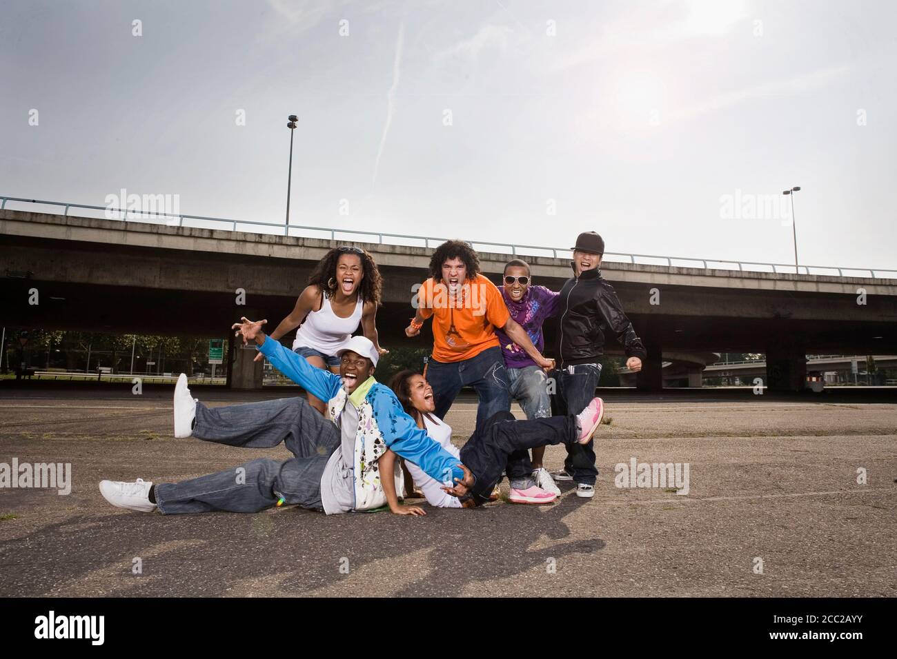 Germany, Cologne, Group of people shouting, portrait Stock Photo