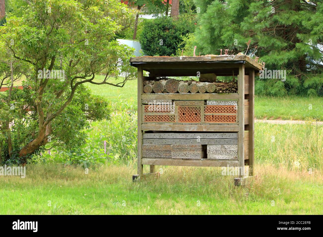 a wild bee and insect shelter hotel Stock Photo - Alamy