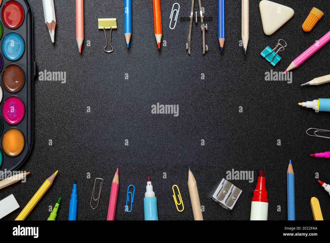 School supplies on black background - top view Stock Photo