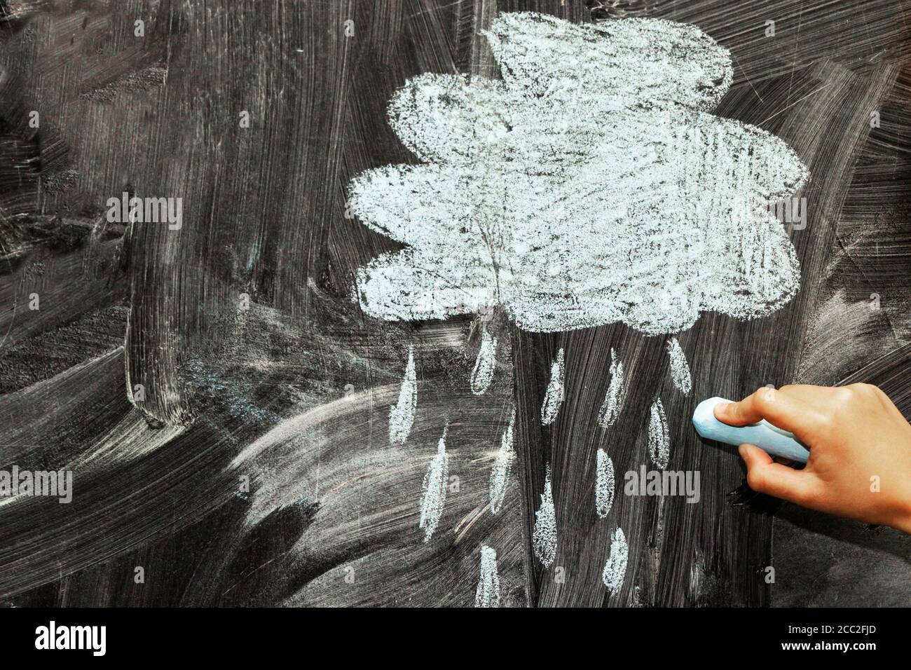 A cloud and a rain drawn with chalk on a blackboard Stock Photo - Alamy