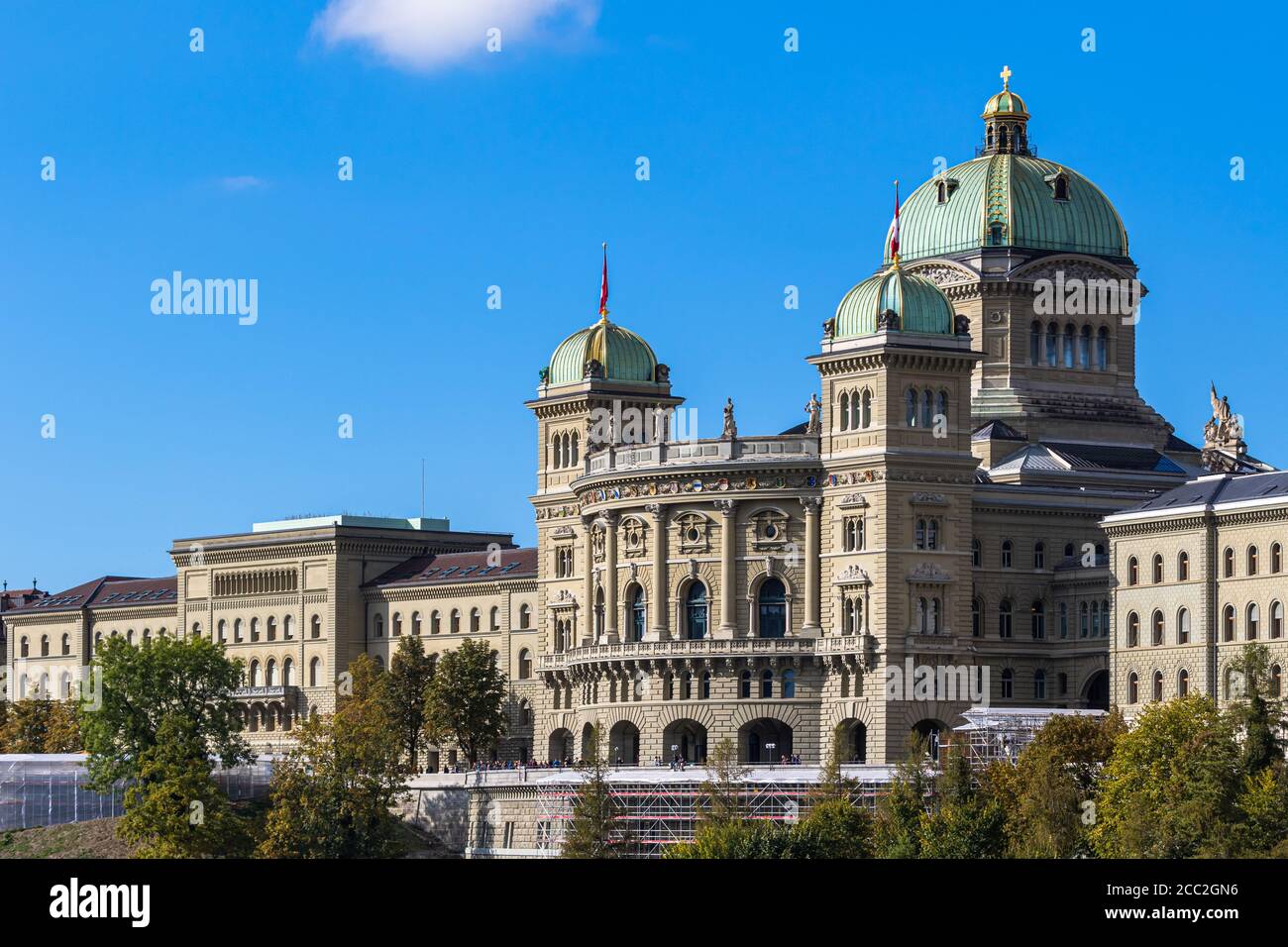 View of Federal Palace of Switzerland (Parliament Building) from south in old town of Swiss capital city Bern on sunny autumn day with blue sky and cl Stock Photo