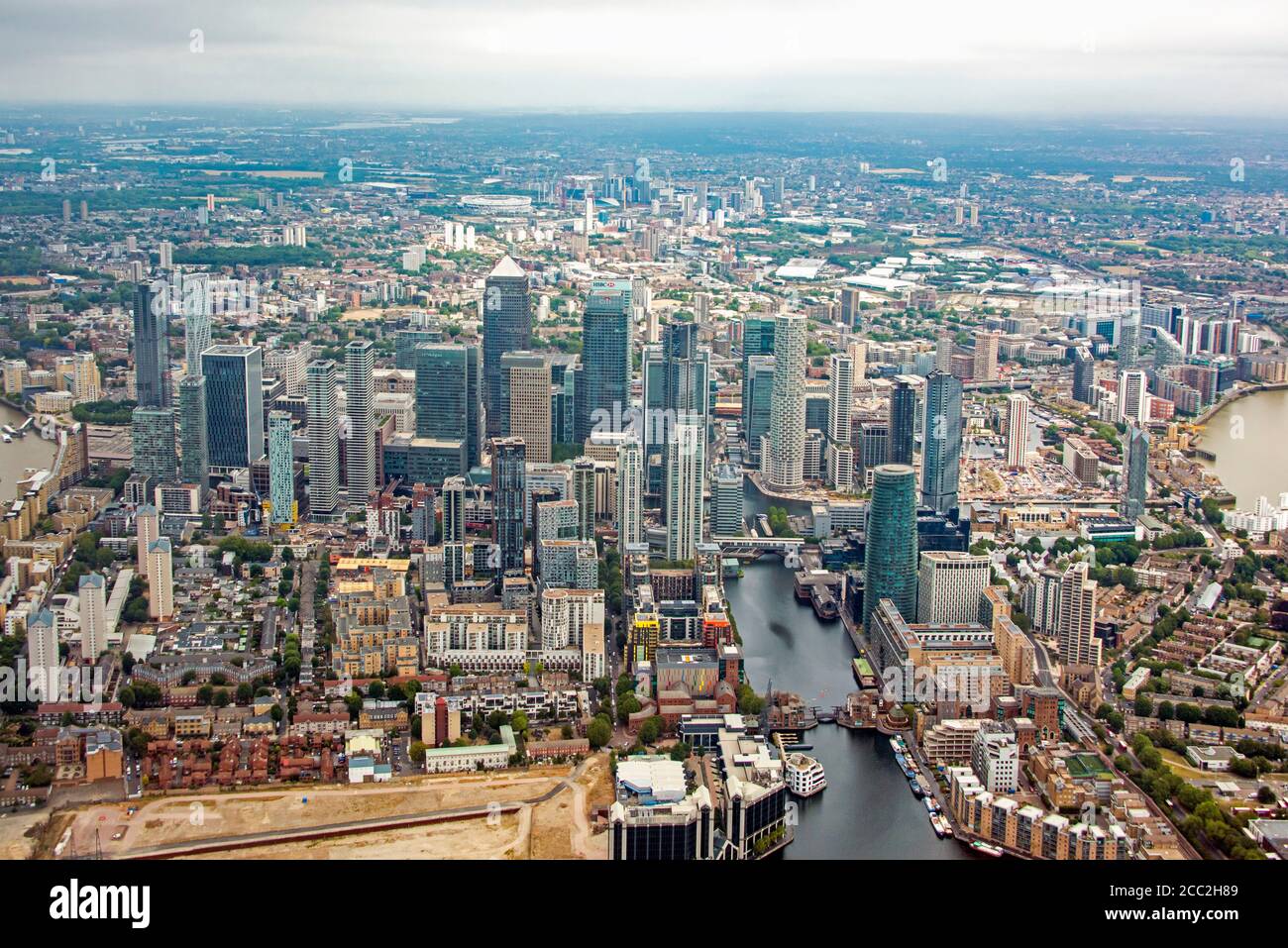 Horizontal aerial view of the skyscrapers in Canary Wharf and the Olympic stadium in East London. Stock Photo