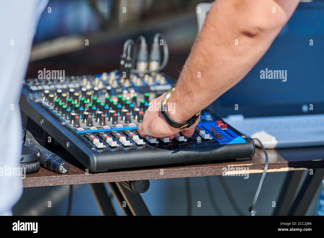 DJ mixer controller. DJ hand control music in open air party