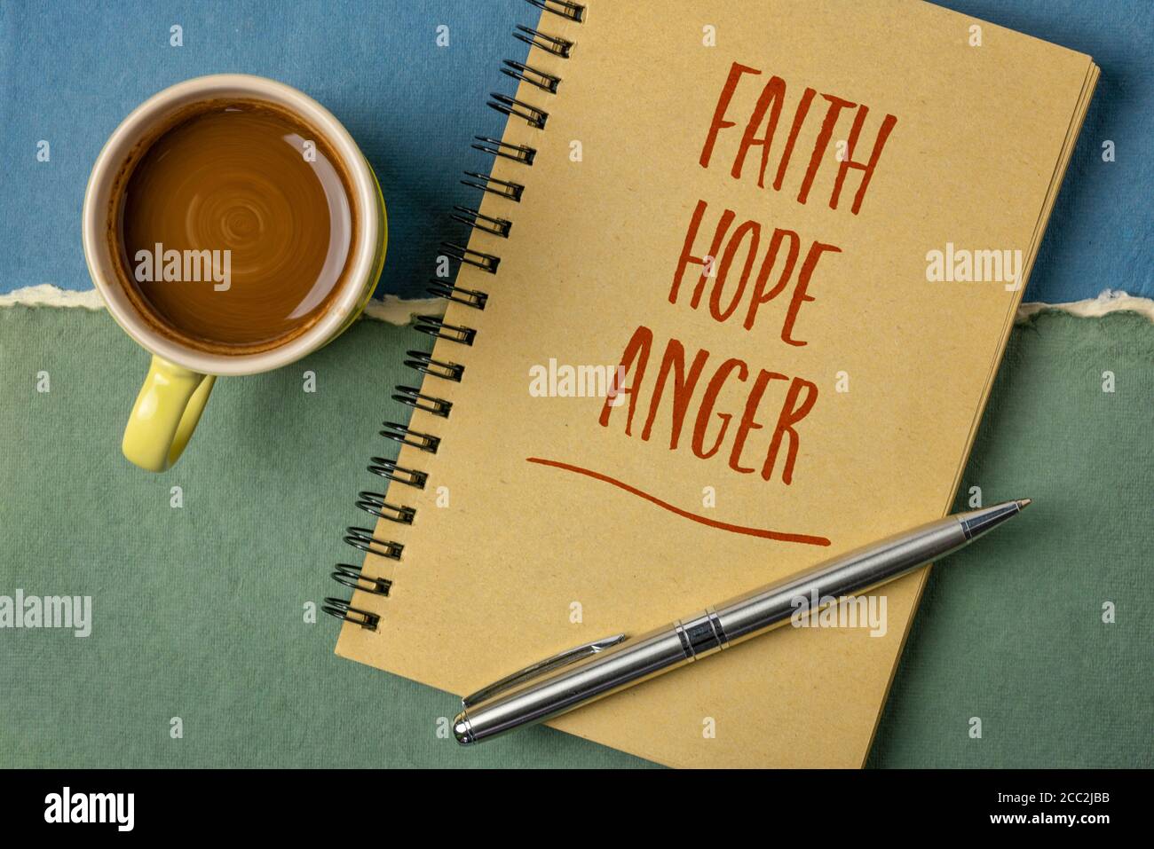 faith, hope and anger emotional word abstract - handwriting in a sketchbook with a cup of coffee, emotions, social issuaes and personal development co Stock Photo