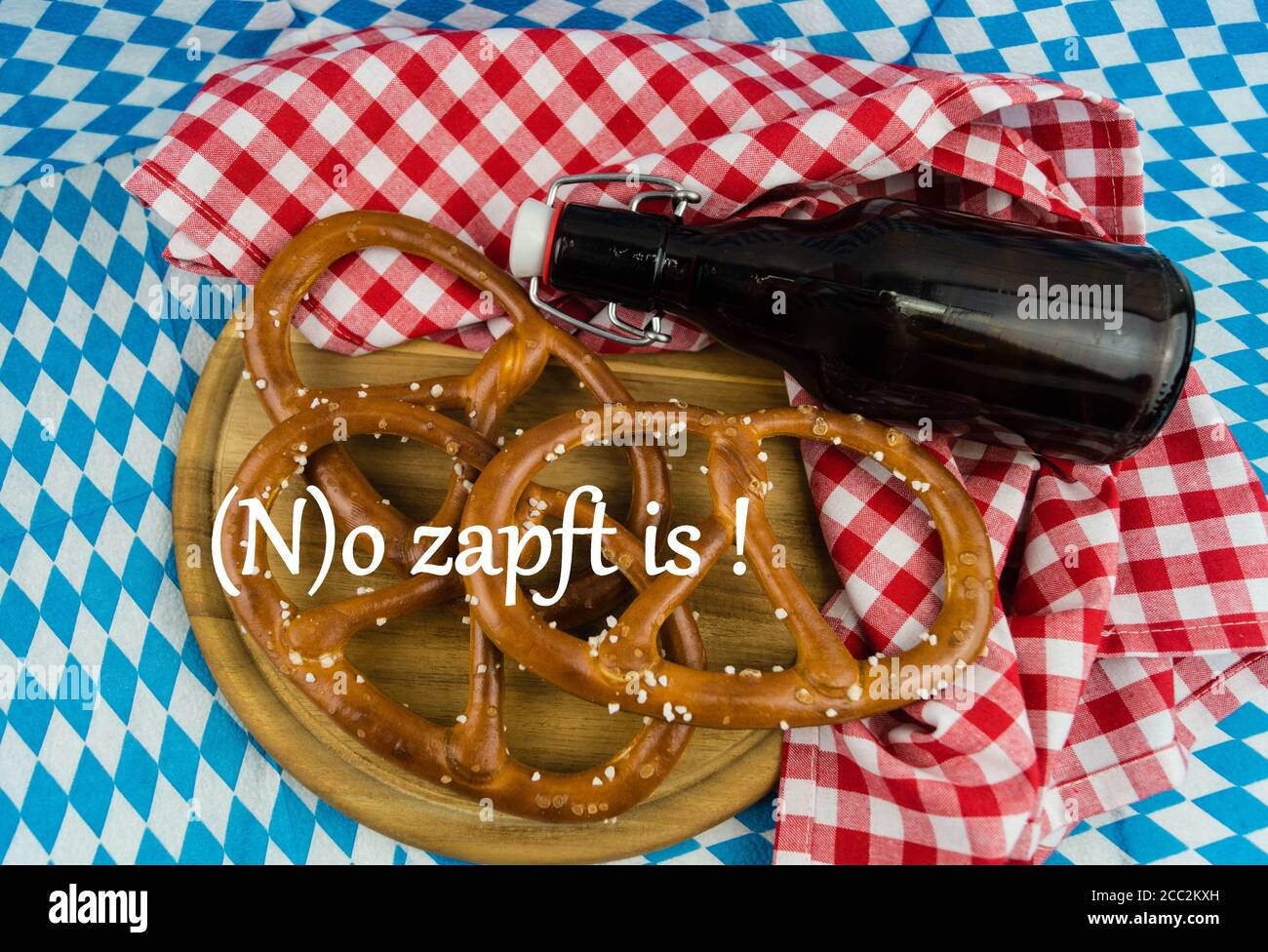 Bavarian Flag with beer and Brezel typical for the Munich beer Festival which is rejected this year caused by corona Lockdown (Translation: o zapft is Stock Photo