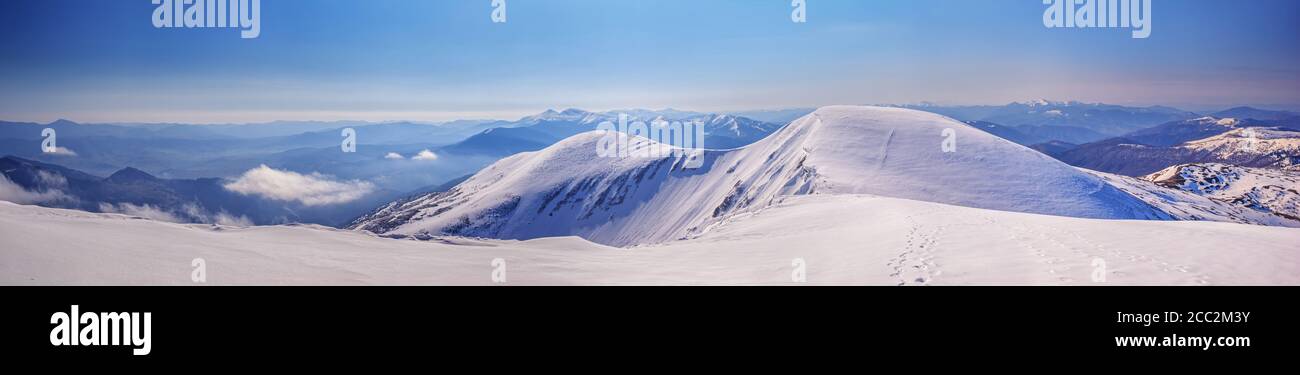 Winter landscape, panorama, banner - top view of the hiking trail on the mountain range of the Carpathian Mountains, in Ukraine Stock Photo