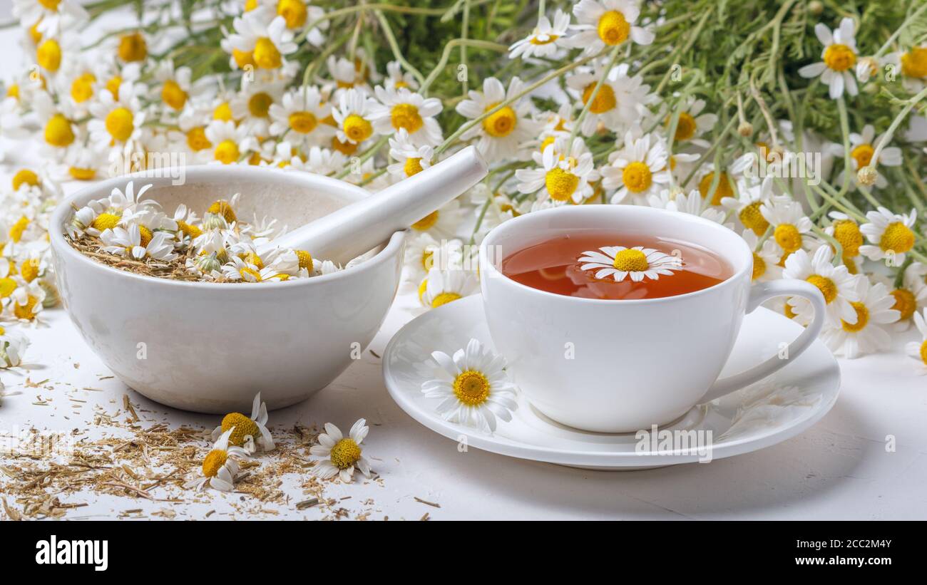 Rural still-life - cup of brewed chamomile tea on the background of a ...