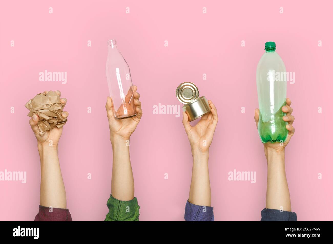 Human hands keep garbage on a pink background. Stock Photo