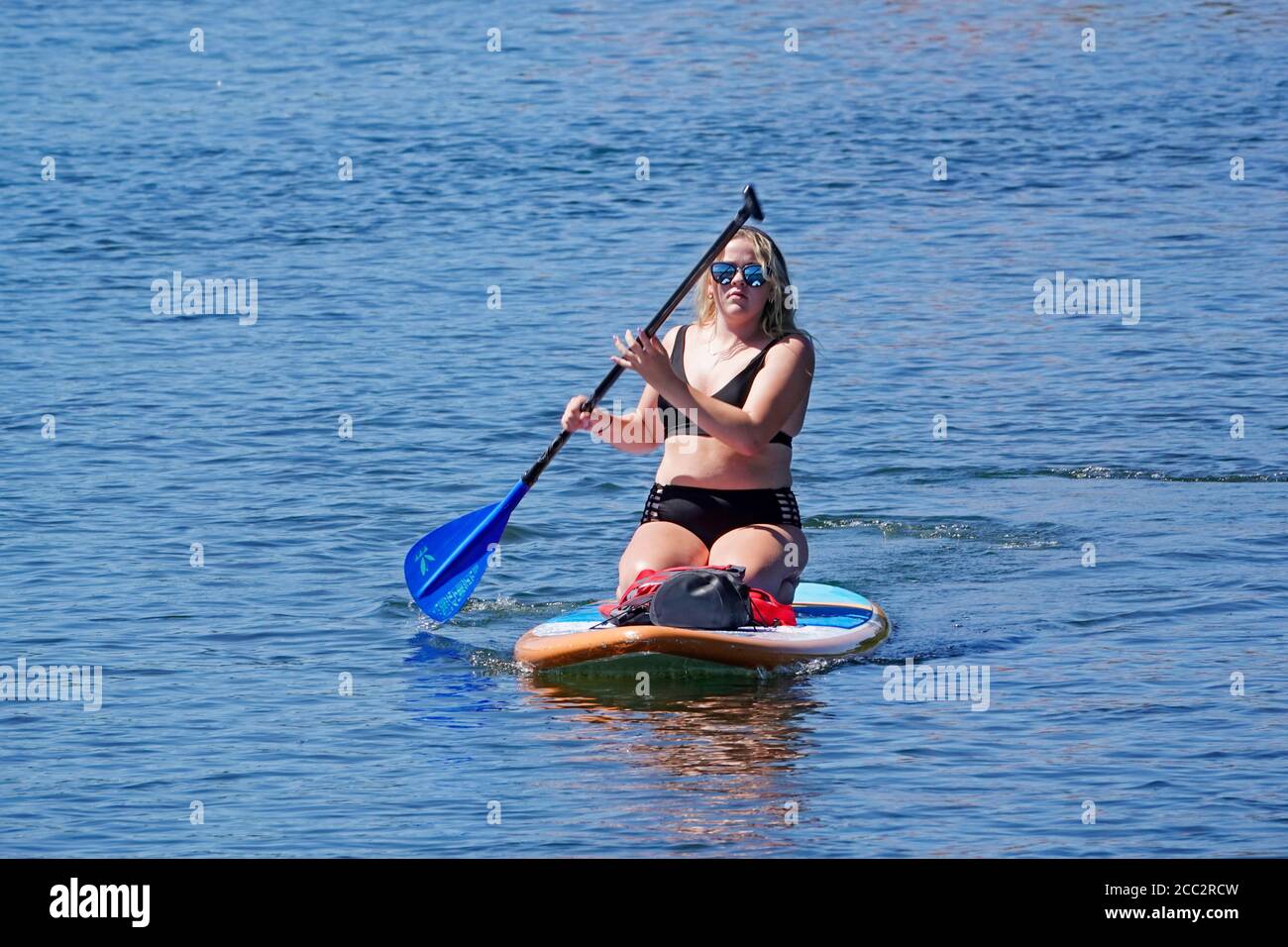 Tourists utilizing the Deschutes River in Bend, Oregon, during the summer. The river is a popular spot for rafters, floaters, paddleboarding, and kaya Stock Photo