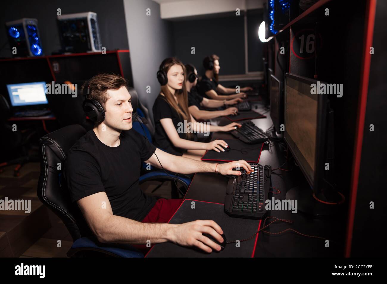 Casual gamers and hardcore fans are gather together in pc gaming club to  compete in playing MMO Games online Tournament Stock Photo - Alamy