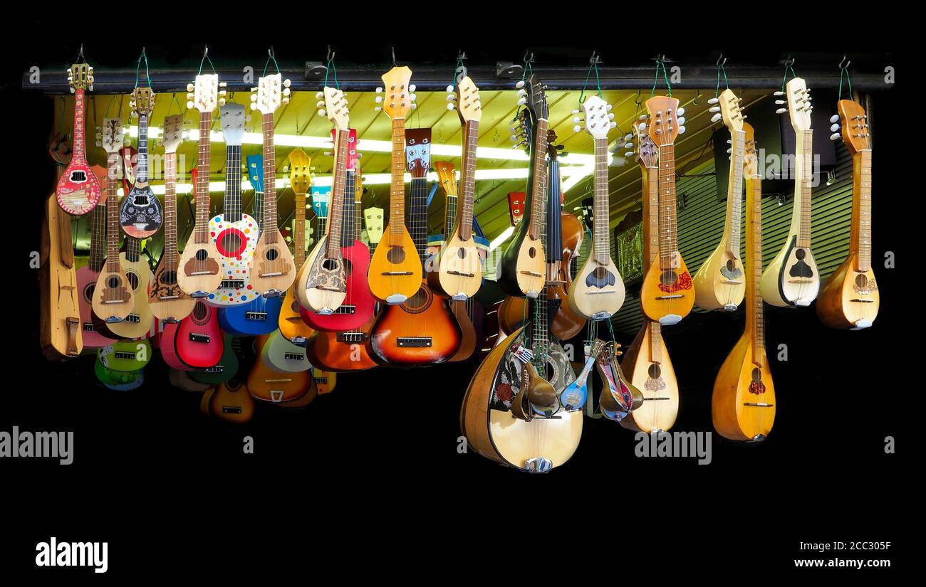 Inexpensive Stringed Instruments Display Sold as Souveneirs on Black ...