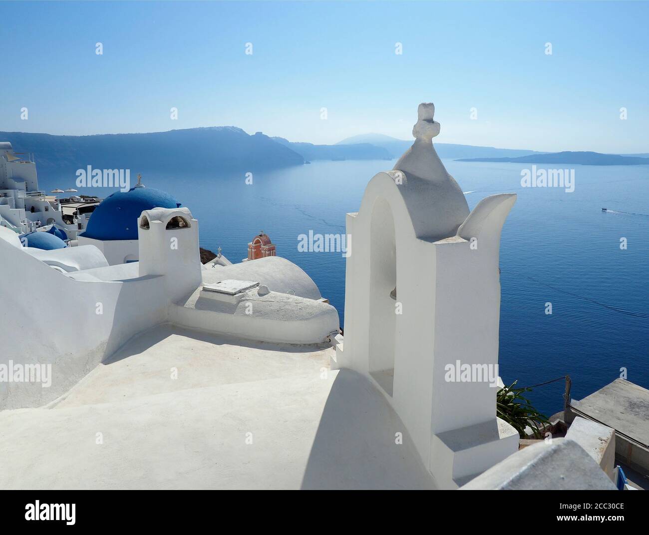 A Unique View of the Whitewashed Buildings and Harbor of Santorini, Greece Stock Photo
