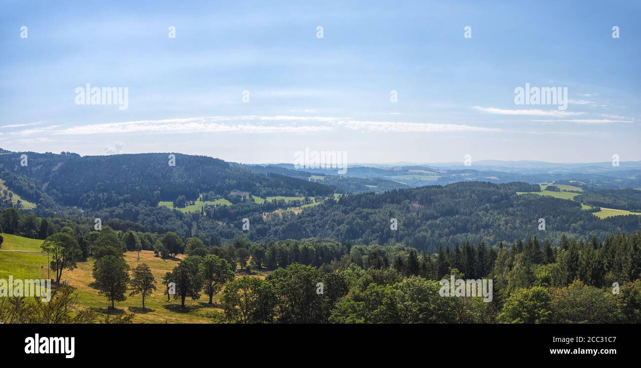 beautiful landscape with hills and forests, blue sky with clouds Stock Photo
