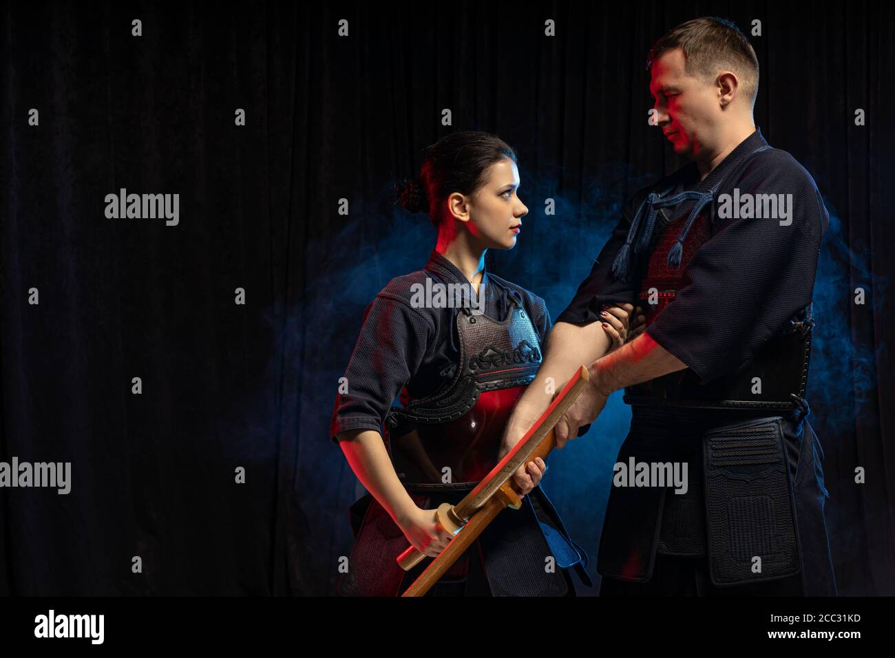 young caucasian student learn how to fight with Kendo Sword. kendo fighters practicing, combat