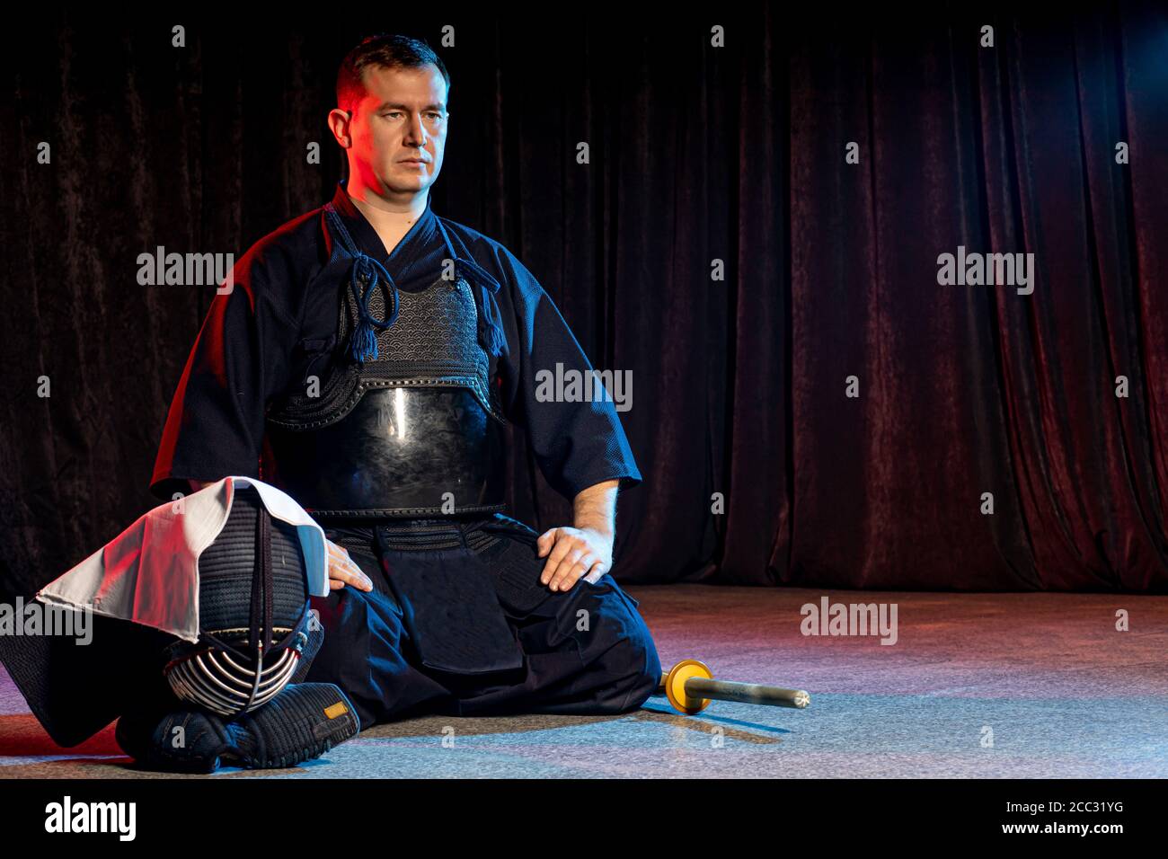kendo combat warrior in traditional dress sit on the floor, before
