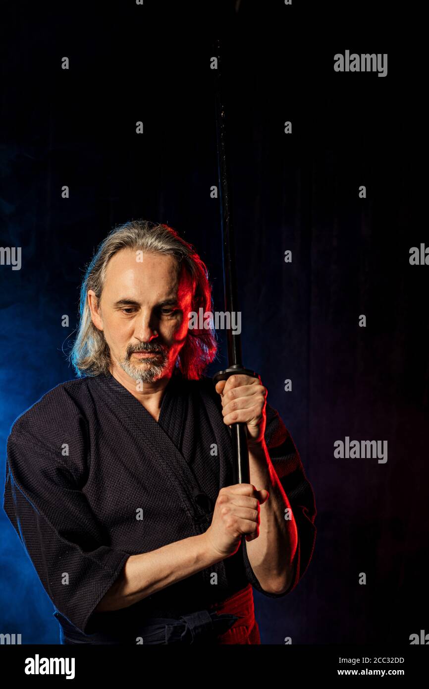 strong caucasian kendo fighter in traditional clothes. japanese martial arts, combat warrior