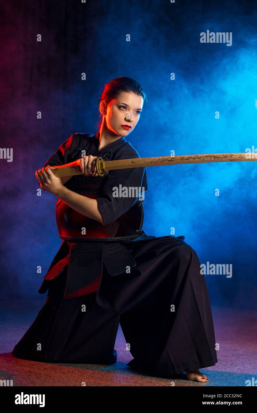 kendo girls concept. female kendo fighter keen on traditional martial