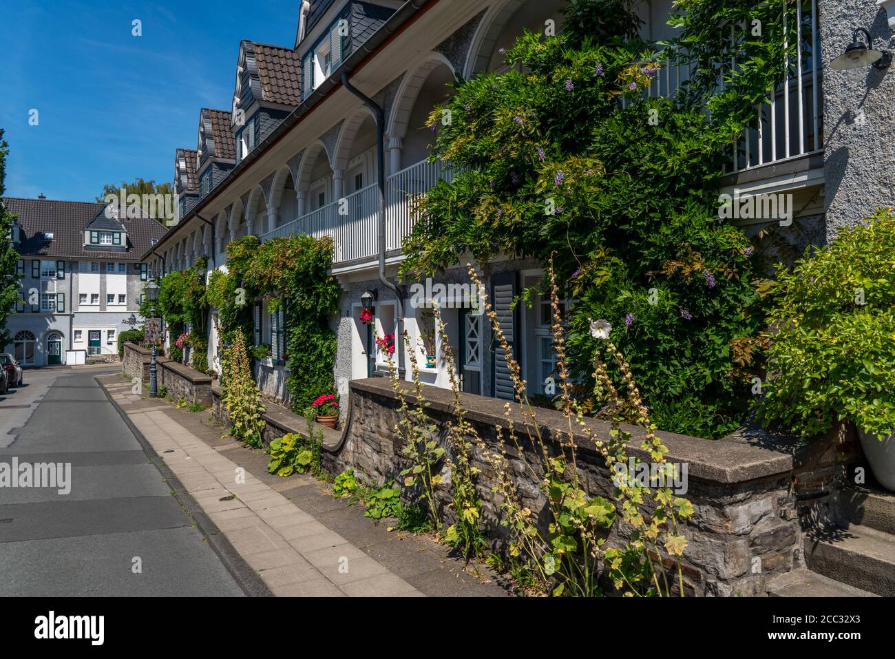 Houses on the market place of the Margarethenhöhe settlement, listed garden city settlement, built from 1906 to 1938, Essen, Germany Stock Photo
