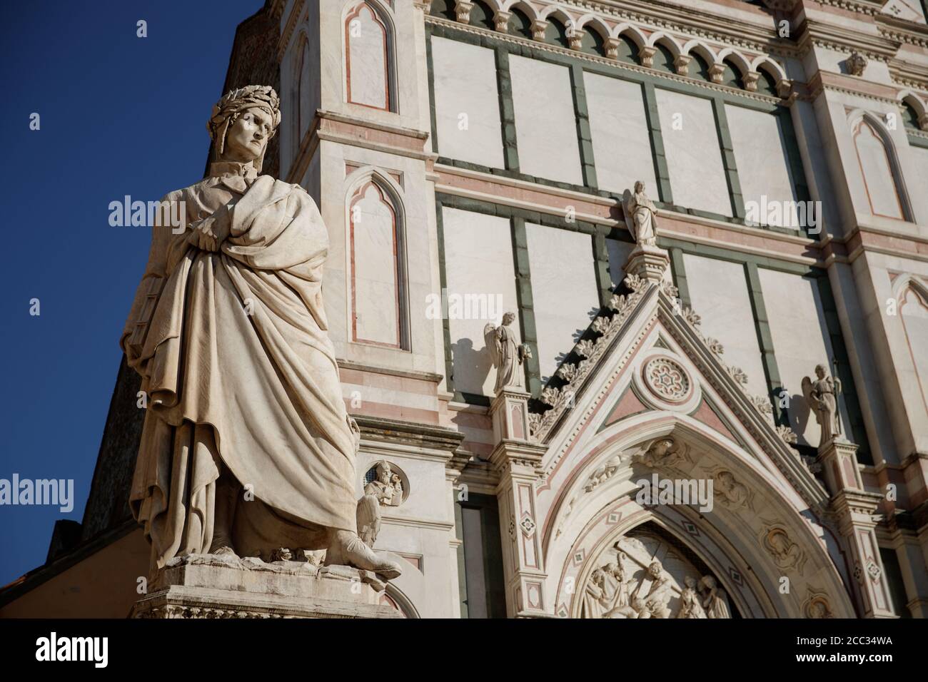 Statue of Italian poet, writer & Philosopher and political thinker Dante Alighieri on Piazza di Santa Croce in Florence by the Basilica de Santa Croce Stock Photo