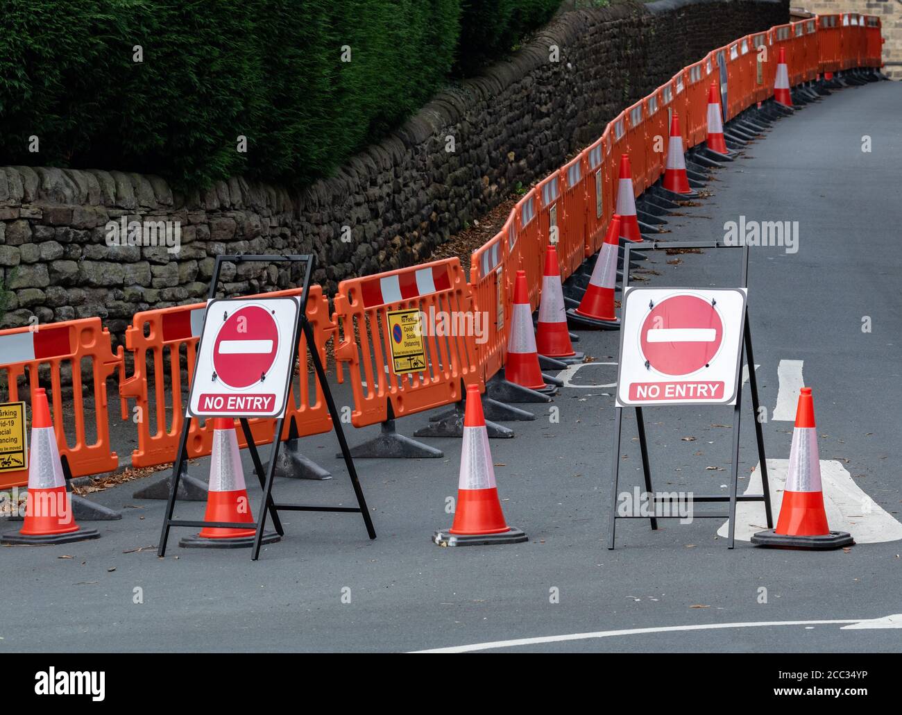 A road block in Baildon, Yorkshire. No Entry Signs, cones and barriers have been erected to stop traffic entering. Stock Photo