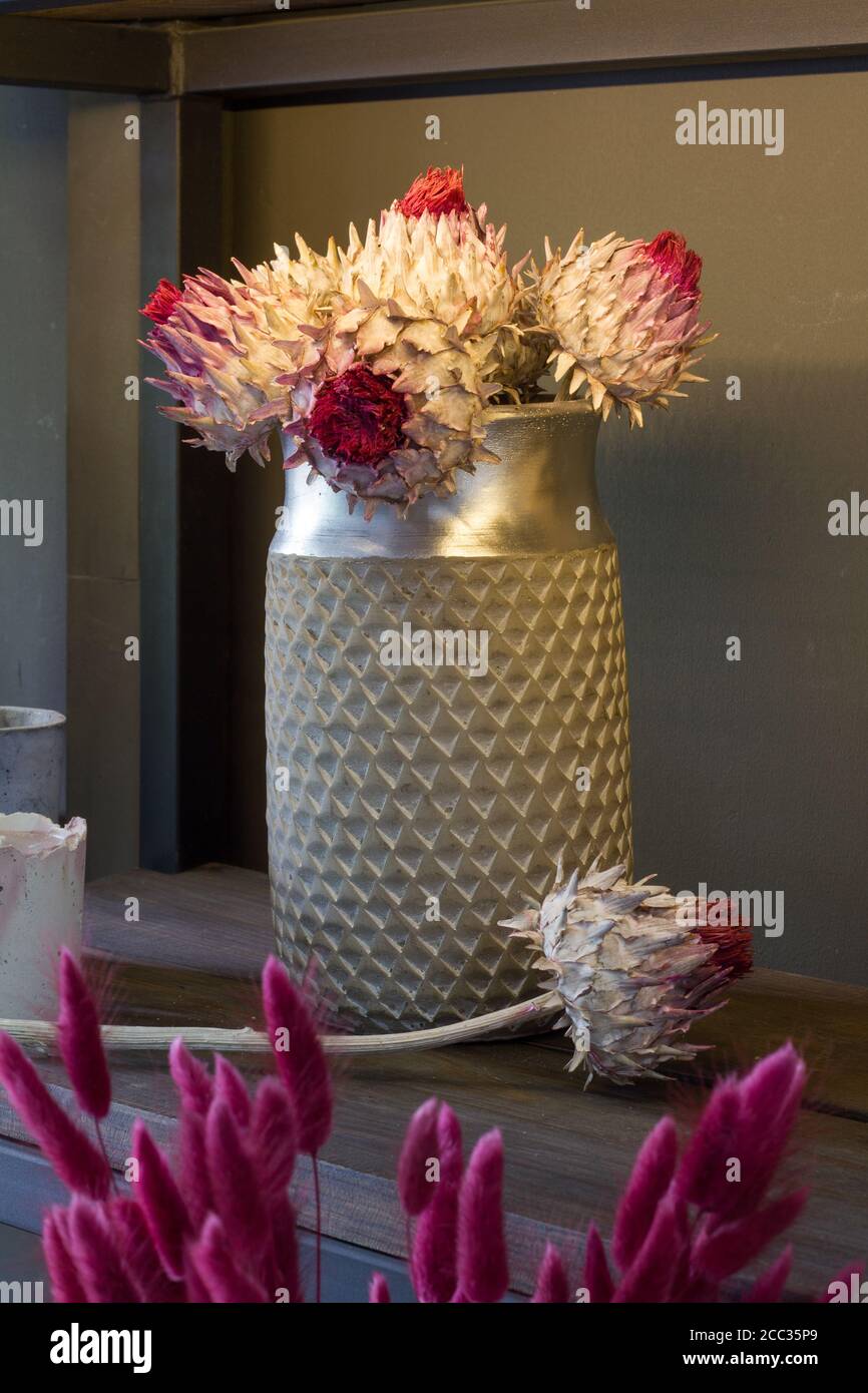 Florist shop interior, shelves with vases of dried flowers, bouquets of dried flowers, selective focus Stock Photo