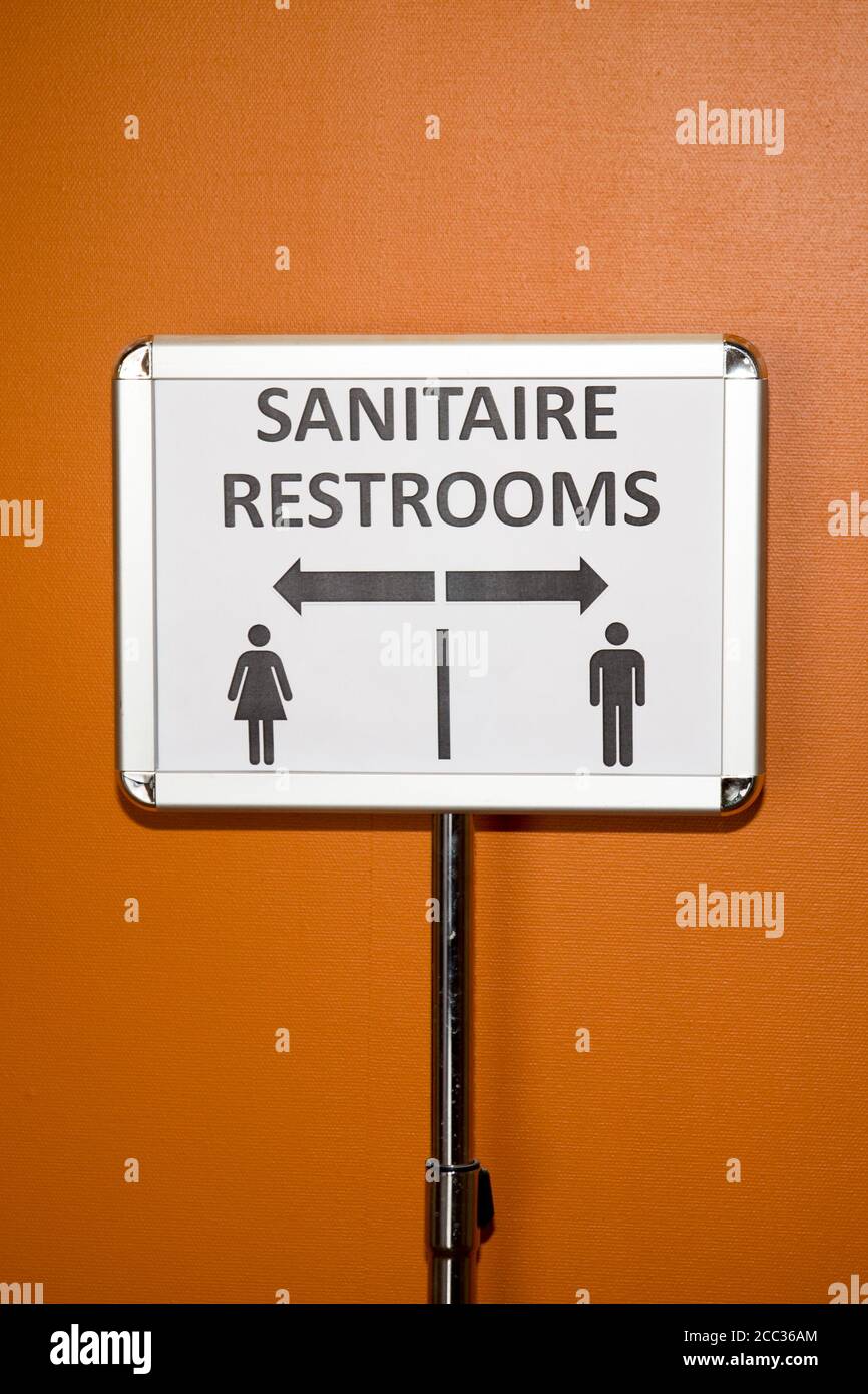 sign signal the direction of the toilet in French and in English Stock