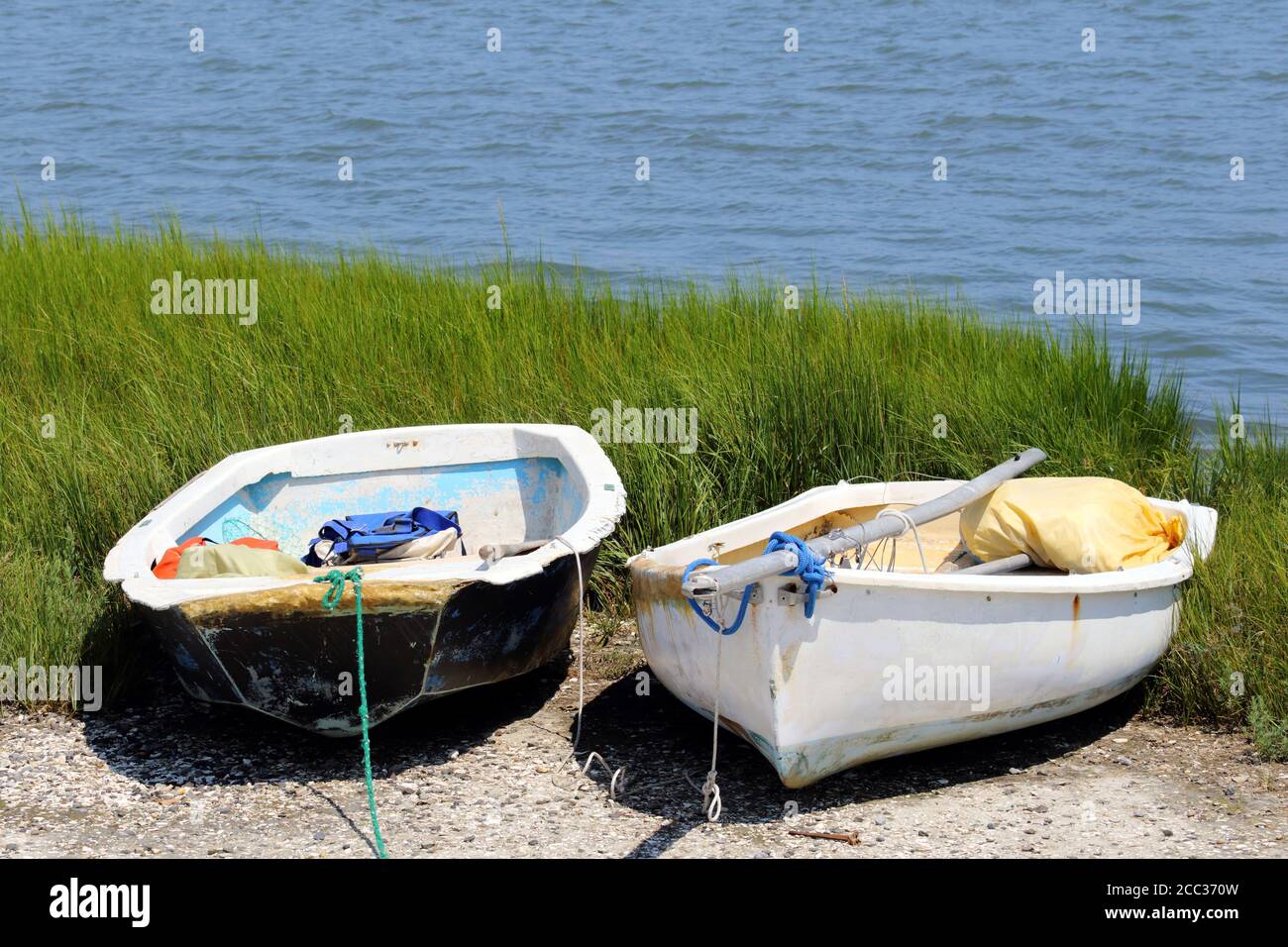 Two small rowboats aground near an inlet in Cape May, New Jersey, USA Stock Photo