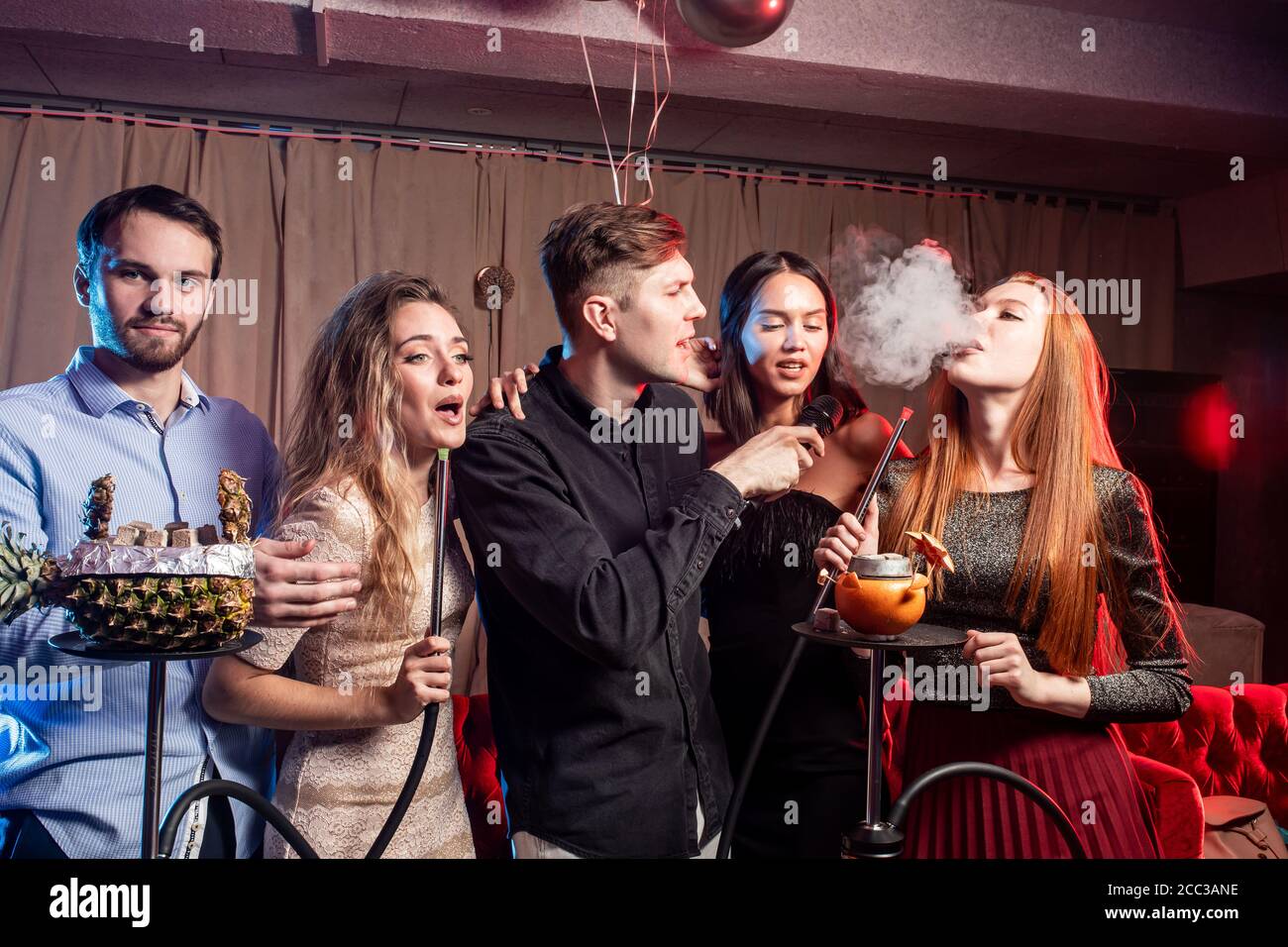 holidays in modern karaoke, young people enjoy pastime in karaoke