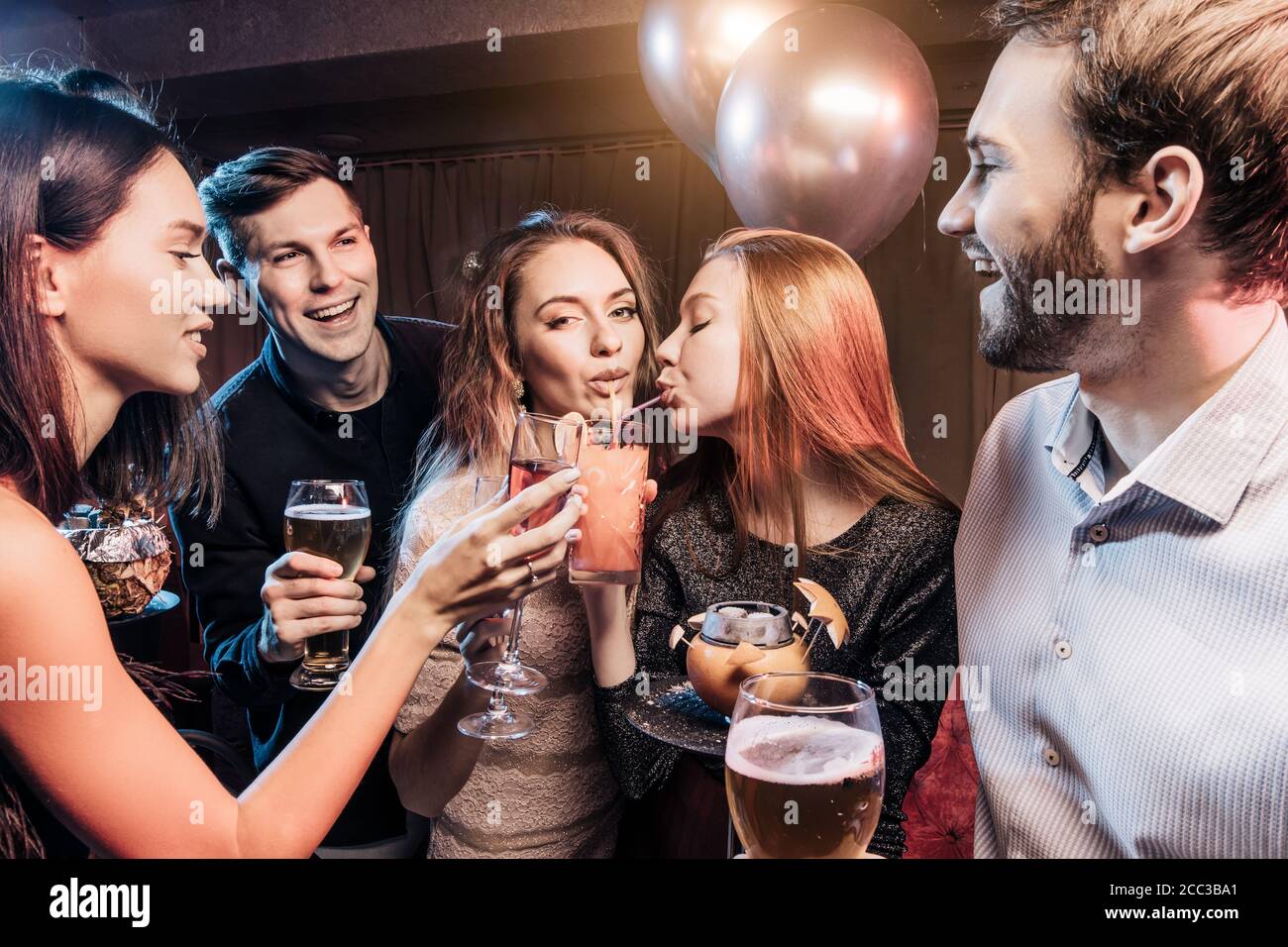 good looking cheerful happy young people have party time in karaoke bar wearing party dresses and shirts. Holiday celebration party concept Stock Photo Alamy