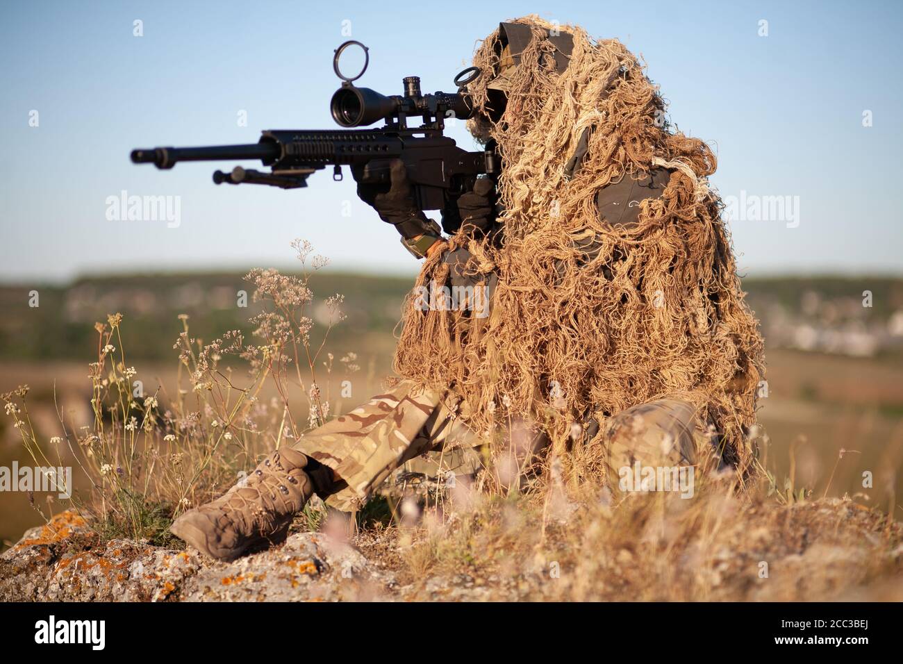 Sniper in Camouflaged Suit with Rifle Stock Image - Image of