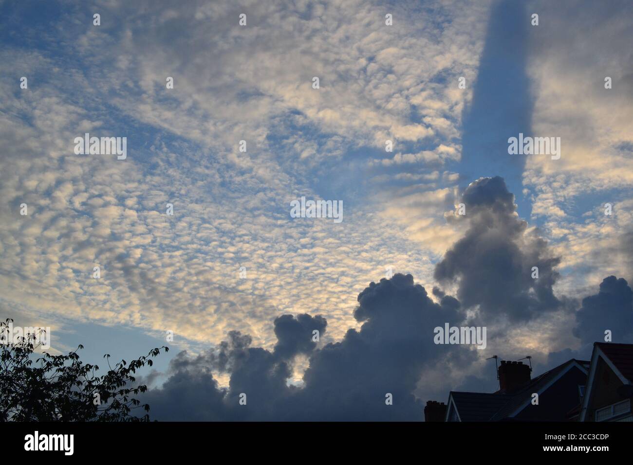 Evening cloudscape of storm cumulous and cirrus mackerel sky in mid