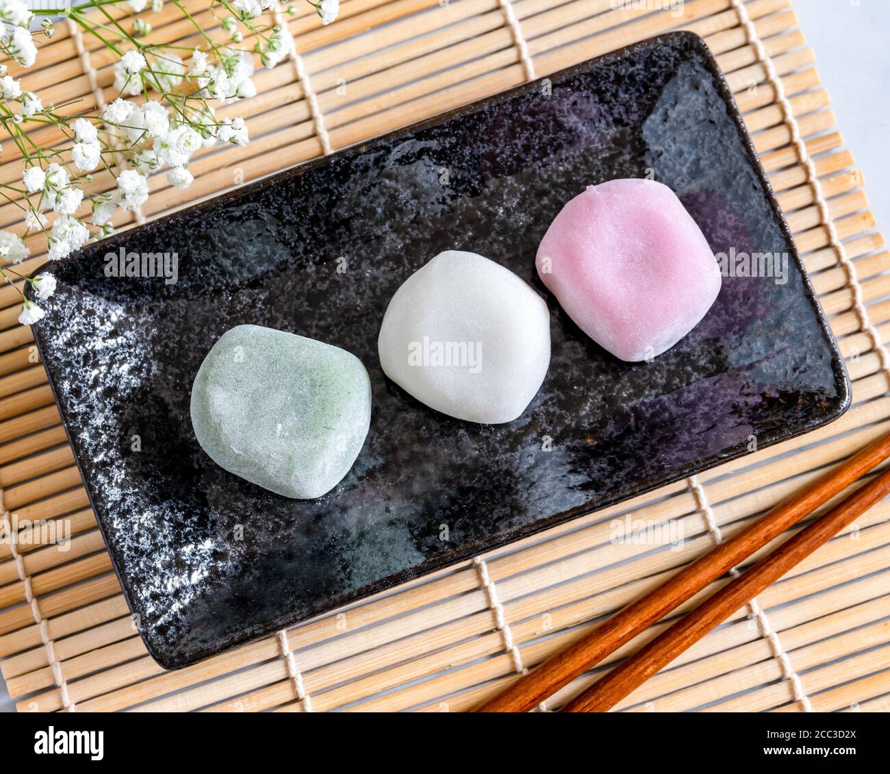 Different Flavors Of Mochi On A Black Rectangular Plate And Baby Breath Flowers Background Blur Stock Photo Alamy Different Flavors Of Mochi On A Black Rectangular Plate And Baby Breath Flowers Background Blur Stock Photo Alamy