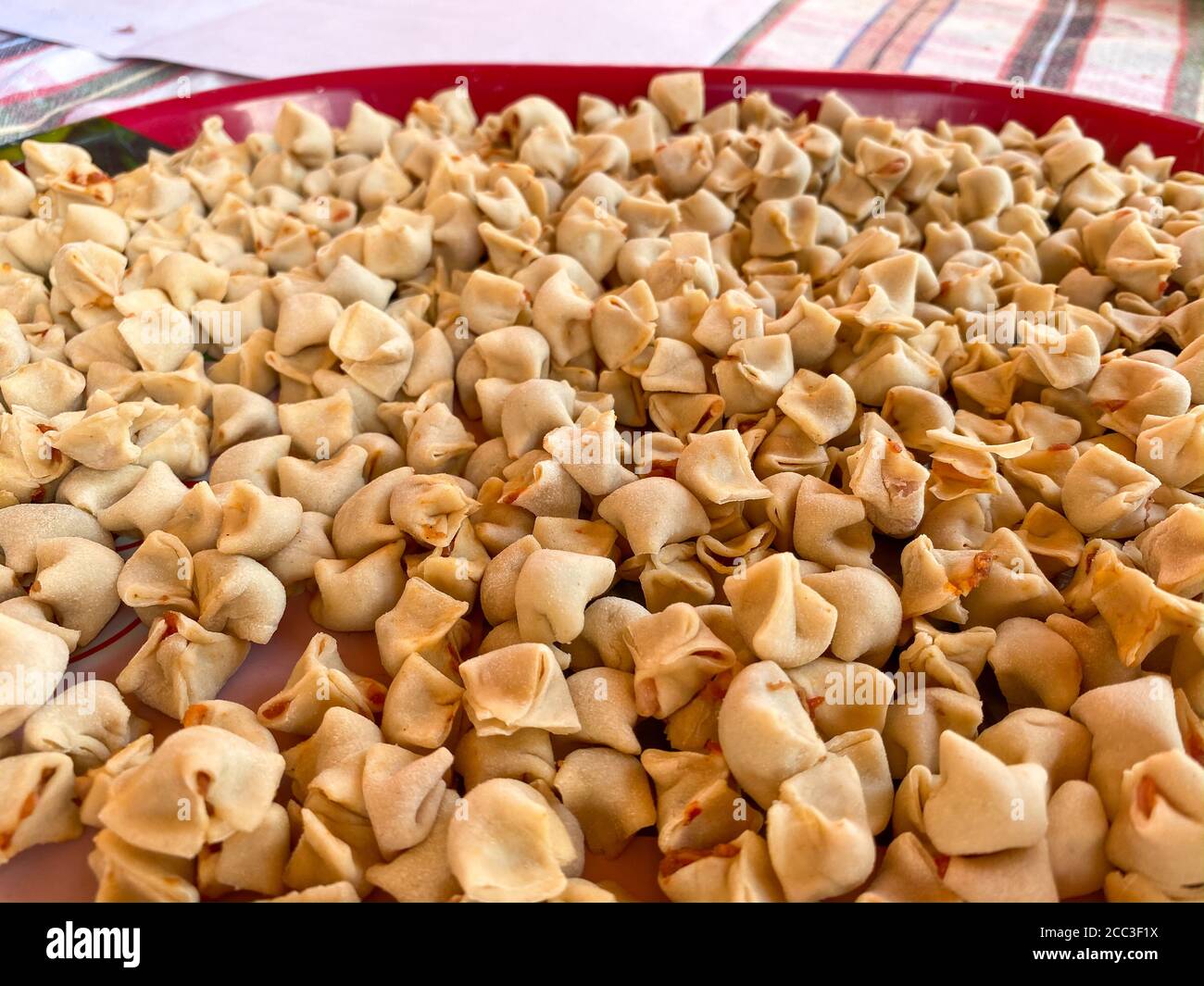 Making meaty ravioli, Turkish known as 