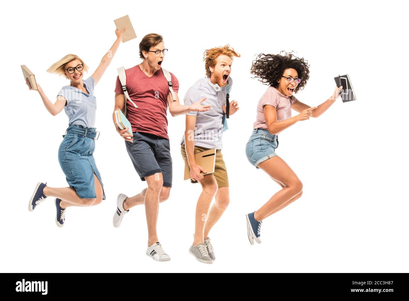 Excited multiethnic students with backpacks and books jumping isolated ...