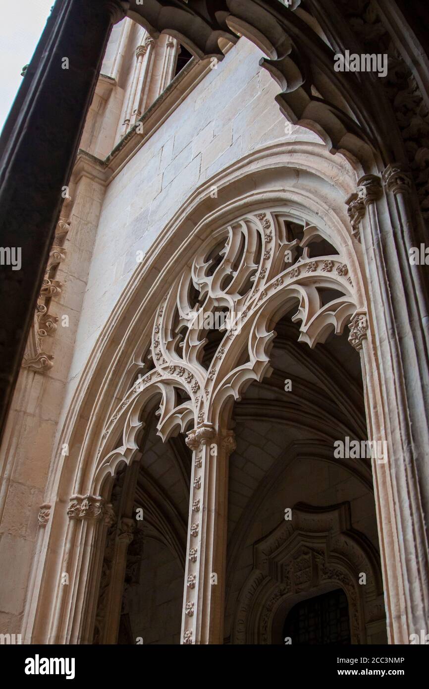 Toledo, Spain- August, 2020: A gotic stoned window at the cloister of Monastery of San Juan de los Reyes in old town Toledo, wolrd heritage site by UN Stock Photo