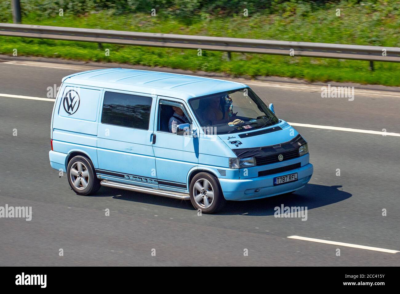 1999 blue VW Volkswagen 800 Special TD SWB; Vehicular traffic moving vehicles, cars driving vehicle on UK roads, motors, motoring on the M6 motorway highway network. Stock Photo