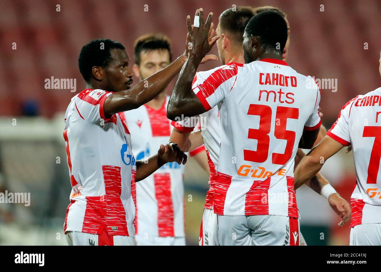 Belgrade. 18th Aug, 2020. Crvena Zvezda's El Fardou Ben Nabouhane (L)  celebrates goal with teammates during UEFA Champions League first  qualifying round football match between Crvena Zvezda and Europa FC in  Belgrade